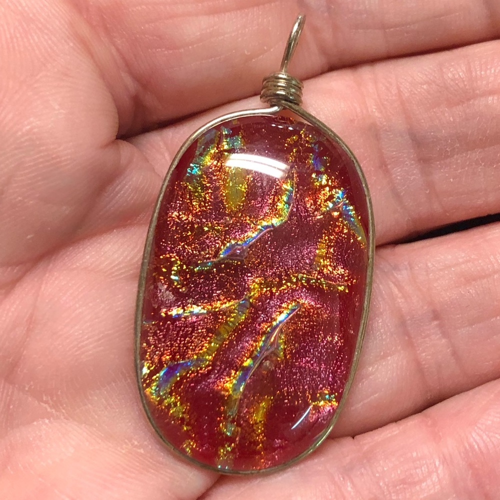 Silver wrapped orange glass pendant
